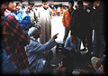 A storyteller teaches from the Koran in early morning.